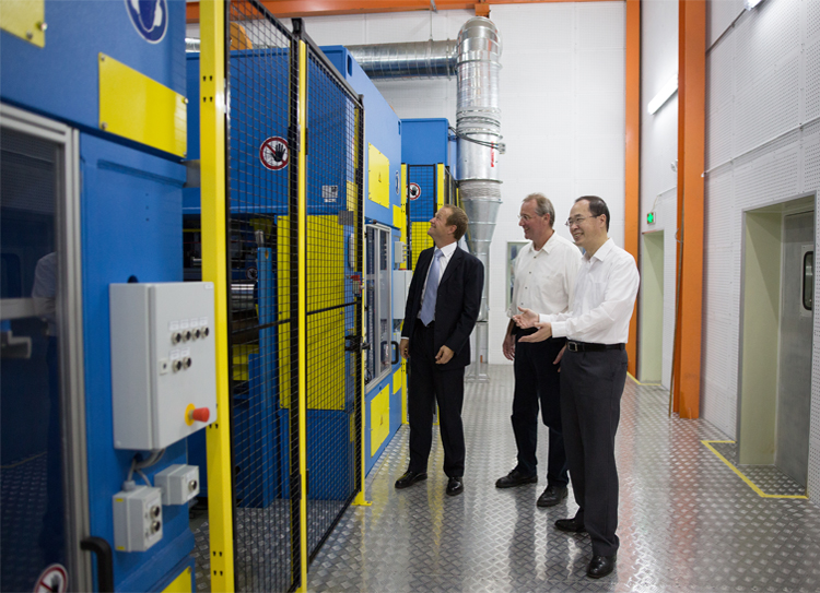 Dr. Heislitz, Mr. Mitsch and Lawrence Wu at the new line. 